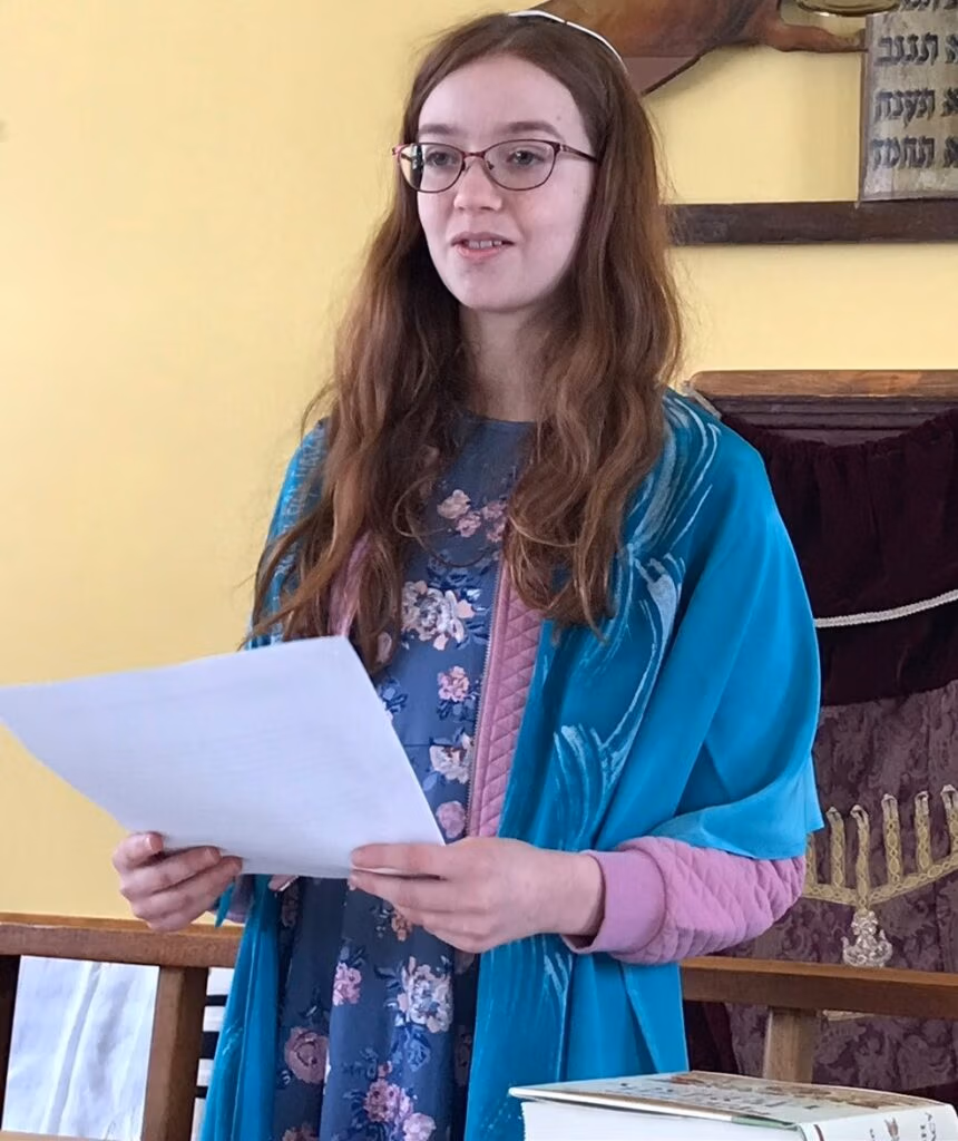 Jewtor online bat mitzvah student, T., at her bat mitzvah in a historic synagogue